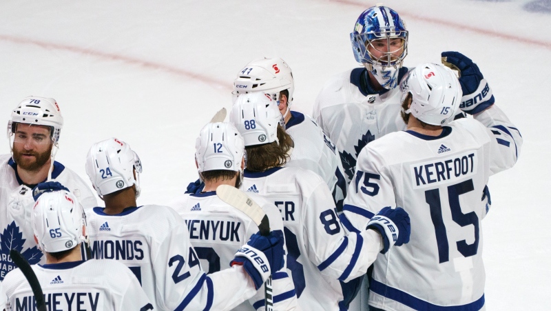 Toronto Maple Leafs line up to celebrate their victory with goaltender Jack Campbell following third period NHL Stanley Cup playoff hockey action against the Montreal Canadiens, in Montreal, Tuesday, May 25, 2021. THE CANADIAN PRESS/Paul Chiasson