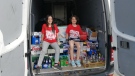 Jayden and Paige Marsh with bottle and can donations in London, Ont. on Saturday, May 29, 2021. (Jordyn Read/CTV London)