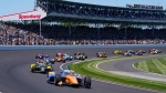 Scott Dixon of New Zealand leads the field through the first turn on the start of the Indianapolis 500 auto race at Indianapolis Motor Speedway in Indianapolis, Sunday, May 30, 2021. (AP Photo/Darron Cummings) 