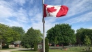 A Canadian flag flys at half mast outside Sir Issac Brock Public School (Sean Irvine CTV News) 
