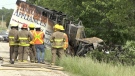 Firefighters look on after a cube van crashed and caught fire in Warwick Township, Ont. on Monday, May 31, 2021. (Jim Knight / CTV News)