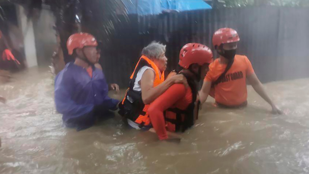 Rescuers evacuate resident in the Philippines