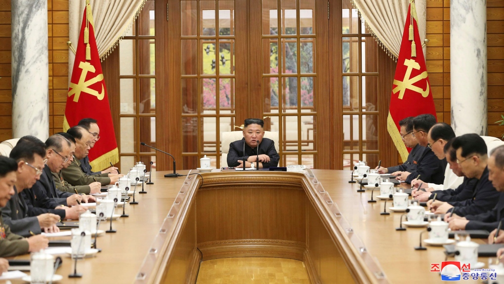 Kim Jong Un presiding over a meeting