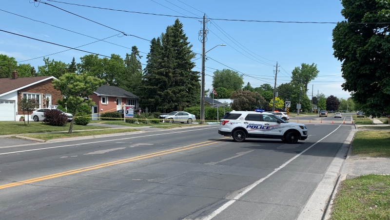 Kingston police in the area of Montreal Street and Sheppard Street, where a car apparently smashed through a bus shelter. Police say the crash is believed to be connected with the search for an armed man. Residents of the Rideau Heights area are asked to stay indoors while the search is underway. (Kimberley Johnson / CTV News Ottawa)