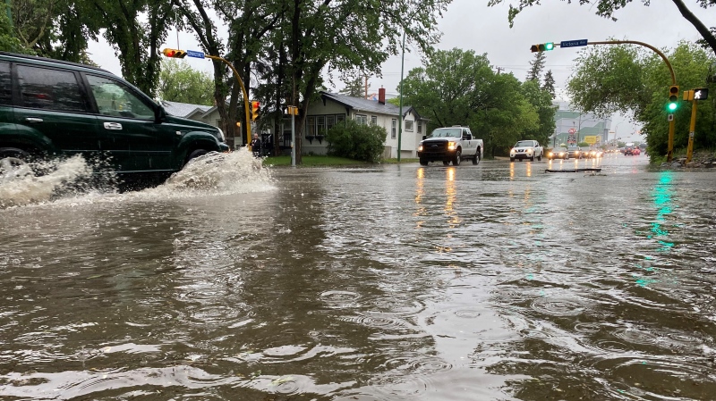 Cars driving through the intersection of Victoria Avenue and Elphinstone Street had to deal with several inches of water after a rainstorm on June 11, 2021. (Gareth Dillistone/CTV News)