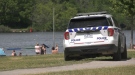 An Ottawa Police Service cruiser drives through Mooney's Bay Park amid increased public health enforcement. (Colton Praill/CTV News Ottawa)