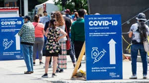 People line up to get their COVID-19 vaccine at a vaccination centre, Thursday, June 10, 2021 in Montreal. THE CANADIAN PRESS/Ryan Remiorz