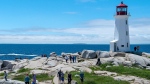 Visitors explore Peggy's Cove, N.S., Saturday, July 4, 2020.  THE CANADIAN PRESS/Andrew Vaughan