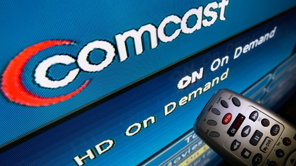The Comcast logo is displayed on a TV set in North Andover, Mass., on Thursday, Aug. 6, 2009. (AP / Elise Amendola)