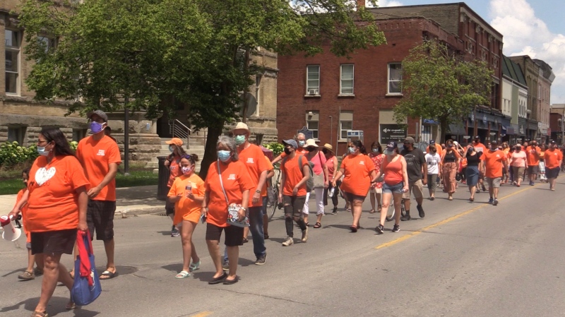 Hundreds dressed in orange walk through downtown St. Thomas, Ont. for the 'Every Child Matters' walk on Monday, June 21, 2021. (Brent Lale / CTV News)