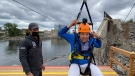 CTV's Tyler Fleming gets ready to ride the new zipline from Ottawa to Gatineau on Tuesday.