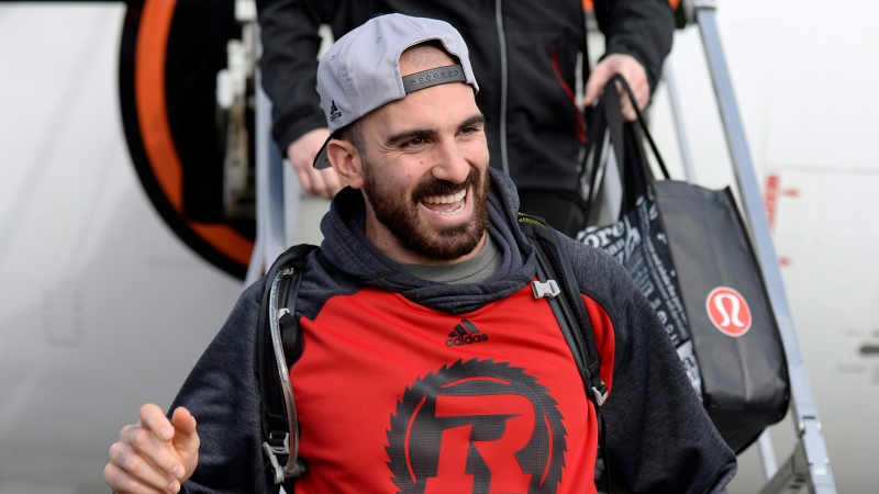 Ottawa Redblacks Brad Sinopoli waves after arriving in Ottawa after winning the Grey Cup, against the Calgary Stampeders, on Monday, Nov. 28, 2016. (THE CANADIAN PRESS/Justin Tang)
