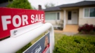 A real estate sign is pictured in Vancouver, B.C., Tuesday, June, 12, 2018. THE CANADIAN PRESS/Jonathan Hayward