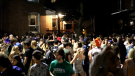 Hundreds of people were seen at a block party on Aberdeen Street in Kingston, Ont. between July 3 and 4, 2021. Three people are charged with organizing the gathering. Kingston police are asking for the public's help identifying partygoers. (Source: Dominic Christian Owens)
