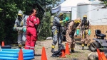 Members of ALERT searching a rural property south of Calgary in July that officials are calling a 'fentanyl superlab.' (Supplied/ALERT)