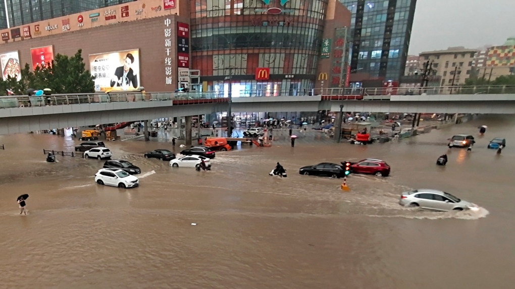 Passengers trapped inside submerged subway as deadly floods sweep central  China | CTV News