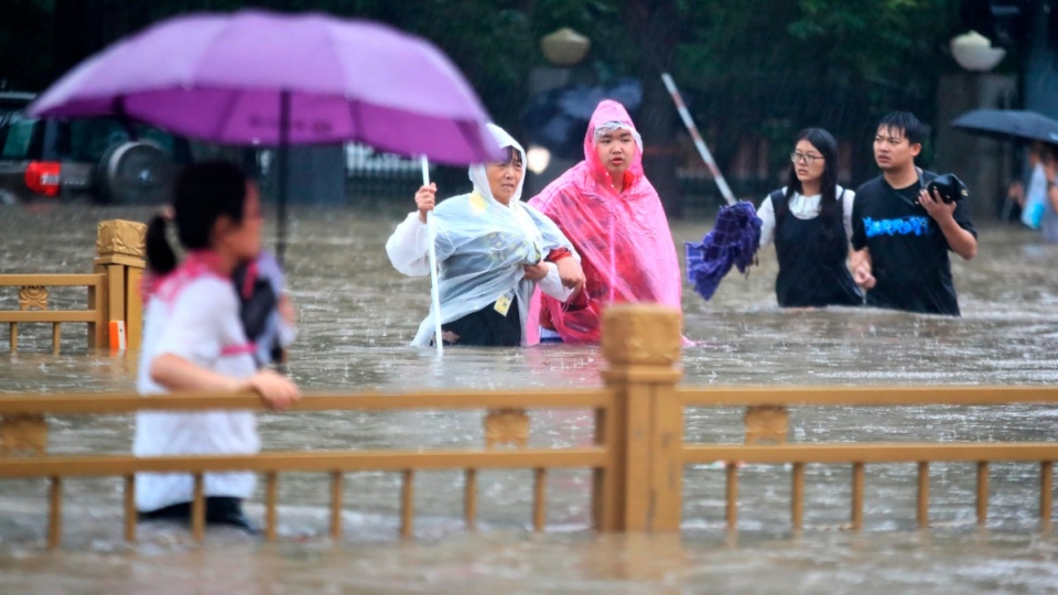 Walking through floodwaters in Zhengzhou, China