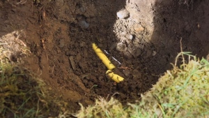 A severed natural gas line is seen in a still image from a FortisBC YouTube video. 