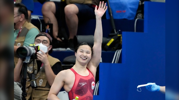Mac Neil finishes first in women’s 100 butterfly to capture Canada’s first gold medal