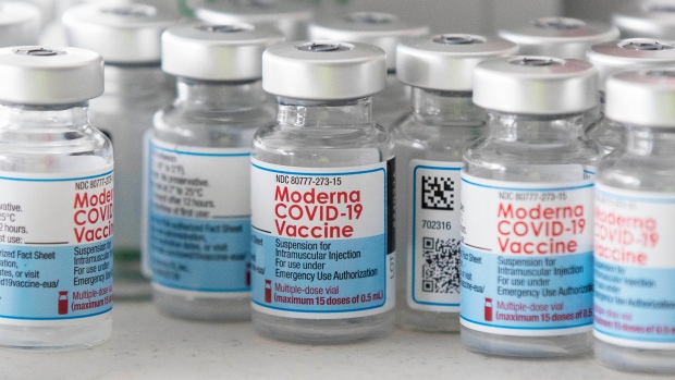 Empty Moderna vaccine vials are shown before a COVID-19 vaccine drive-thru clinic at Richardson stadium in Kingston, Ont., on Friday, Jul. 2, 2021. THE CANADIAN PRESS/Lars Hagberg 