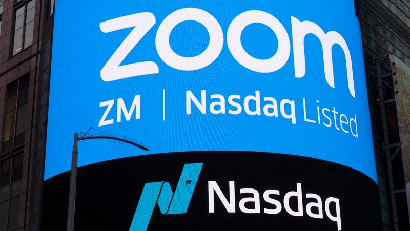 FILE - This April 18, 2019, file photo shows a sign for Zoom Video Communications ahead of their Nasdaq IPO in New York. (AP Photo/Mark Lennihan, File)