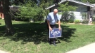 London West Conservative Candidate Rob Flack puts up a lawn sign in North London on the first day of the election campaign Sunday Aug 15, 2021 (Brent Lale / CTV News)