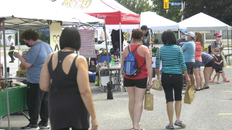 Shoppers walk through the Richmond Village Farmers Market on Sunday. (Shaun Vardon/CTV News Ottawa)