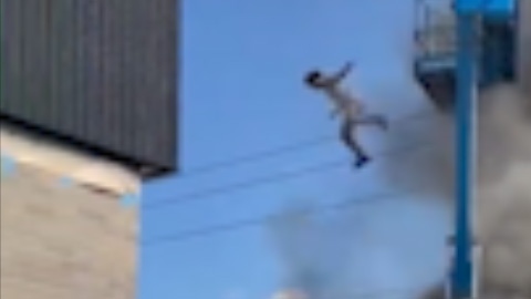 Man jumps from burning cherry picker