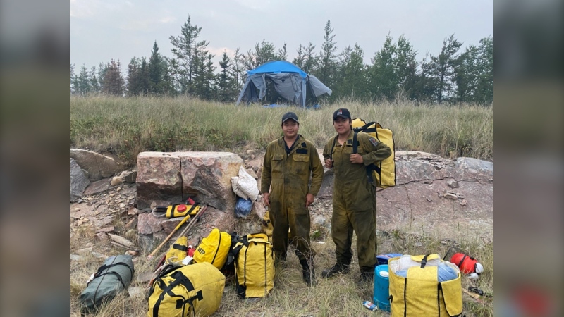 Brody Baptiste and Cody Baptiste pose in this undated handout photo. The two teen firefighters from Berens River First Nation in Manitoba have been assisting with the wildfires in eastern Manitoba since July. THE CANADIAN PRESS/HO - Percy Swain