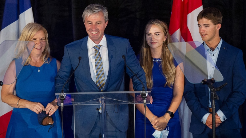 Nova Scotia Progressive Conservative leader Tim Houston, flanked by his wife Carol, daughter Paget and son Zachary, left to right, addresses supporters after winning a majority government in the provincial election at the Pictou County Wellness Centre in New Glasgow, N.S. on Tuesday, Aug. 17, 2021. THE CANADIAN PRESS/Andrew Vaughan 