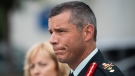 Maj.-Gen. Dany Fortin speaks to reporters outside the Gatineau Police Station after being processed, in Gatineau, Que., on Wednesday, Aug. 18, 2021. THE CANADIAN PRESS/Justin Tang 