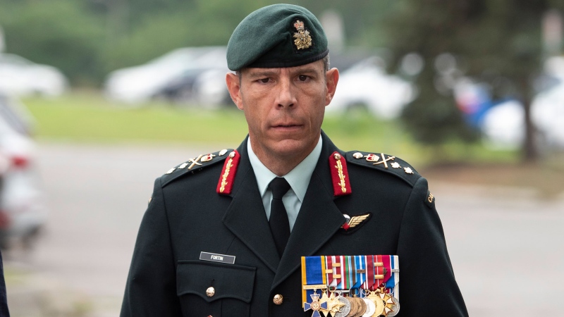 Maj.-Gen. Dany Fortin arrives to be processed at the Gatineau Police Station in Gatineau, Que., on Wednesday, Aug. 18, 2021. THE CANADIAN PRESS/Justin Tang 
