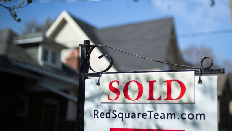 A real estate sold sign is shown in a Toronto west end neighbourhood May 17, 2020. The Toronto Regional Real Estate Board says home sales in the Greater Toronto Area posted a record for August as they rose 40.3 per cent compared with a year ago. THE CANADIAN PRESS/Graeme Roy