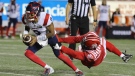 Montreal Alouettes quarter back Vernon Adams Jr. eludes a tackle by Calgary Stampeders' Mike Rose during the final minute of CFL football action in Calgary, Friday, Aug. 20, 2021.THE CANADIAN PRESS/David Chidley