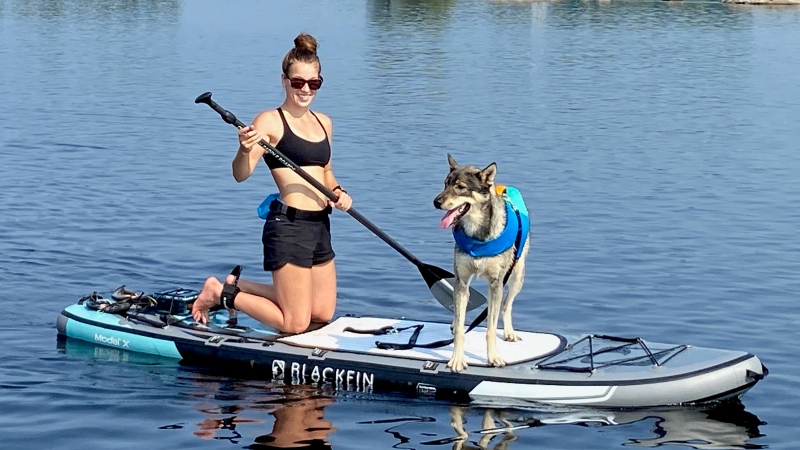 Janelle Wojtowicz and her dog Blitz participate in the Doggy Paddle in support of the Renfrew County SPCA. (Dylan Dyson/CTV News Ottawa)