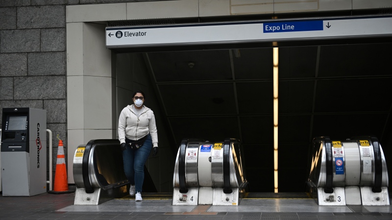 A person wears a face mask as protection against COVID-19 at a Vancouver SkyTrain station. (Shutterstock)