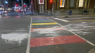 Ottawa police are investigating after paint was apparently splashed and spread across a rainbow Pride crosswalk at Bank and Somerset. (Photo Credit: Matt Elliott)