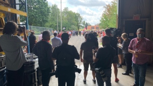 Crowds of protesters await Liberal Leader Justin Trudeau in Cambridge, Ont. (Glen McGregor/CTV News) (Aug. 29, 2021)