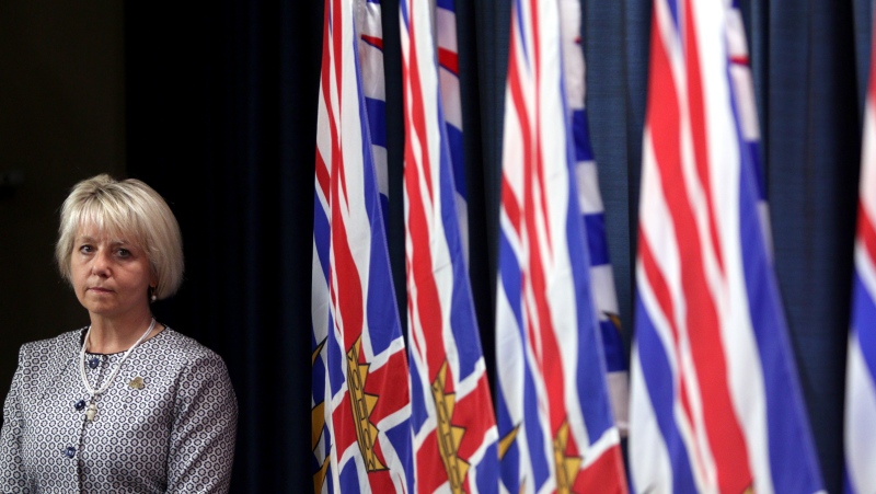 Provincial Health Officer Dr. Bonnie Henry looks on during a press conference about the COVID-19 vaccine card set to arrive in mid-September during a press conference at provincial legislature in Victoria, Monday, Aug. 23, 2021. THE CANADIAN PRESS/Chad Hipolito 