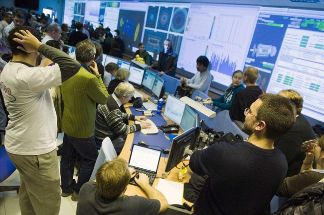 Scientists gather at the European Organisation for Nuclear Research (CERN) data quality satellite control centre of the ATLAS detectors during the restart of the Large Hadron Collider (LHC) in Meyrin, near Geneva, Switzerland, Monday, Nov. 23, 2009. (AP / Keystone, Laurent Gillieron)