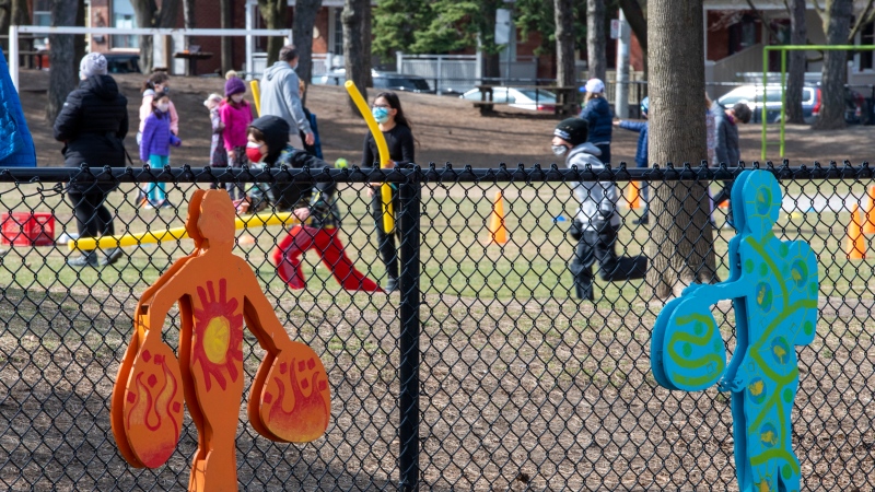 School children play in the yard of Adam Beck public school in Toronto on Tuesday, April 6, 2021. THE CANADIAN PRESS/Frank Gunn 