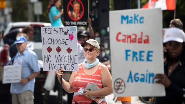 Anti-vaccine protesters now gathered outside Toronto General Hospital