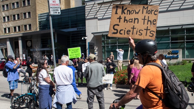 Anti-vaccine protesters gather outside Toronto General Hospital as part of nationwide action