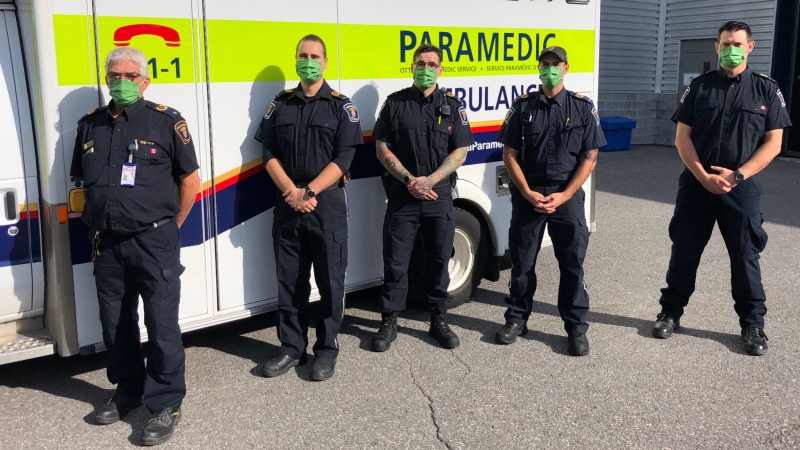 An Ottawa paramedic crew of three members (middle), including one who was on his very first shift, helped deliver a healthy baby girl at an Ottawa home Tuesday morning. Left to right: Commander Joe Micucci; PCP Mehran Massom; ACP Simon Blanchard; PCP Mike Vareta; Acting Commander Reid Purdy. (Photo submitted by the Ottawa Paramedic Service)