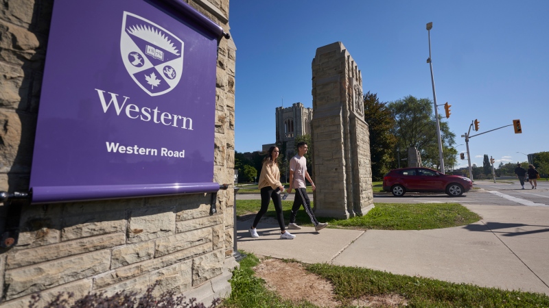 Students walk across campus at Western University in London, Ont., Saturday, Sept. 19, 2020. THE CANADIAN PRESS/Geoff Robins
