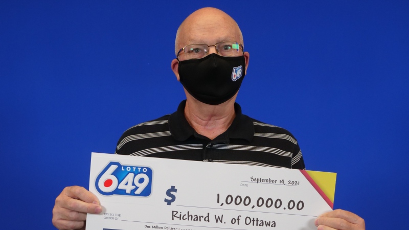 Richard Wiles of Ottawa picks up his $1 million prize from the OLG Prize Centre in Toronto. (Photo courtesy: OLG)
