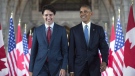 This file photo shows then-U.S. President Barack Obama and Prime Minister Justin Trudeau walking down the Hall of Honour on Parliament Hill, in Ottawa, June 29, 2016. THE CANADIAN PRESS/Paul Chiasson 