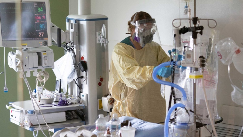 In this file photo, a nurse attends to a patient in the COVID-19 Intensive Care Unit at Surrey Memorial Hospital in Surrey, B.C., Friday, June 4, 2021. THE CANADIAN PRESS/Jonathan Hayward