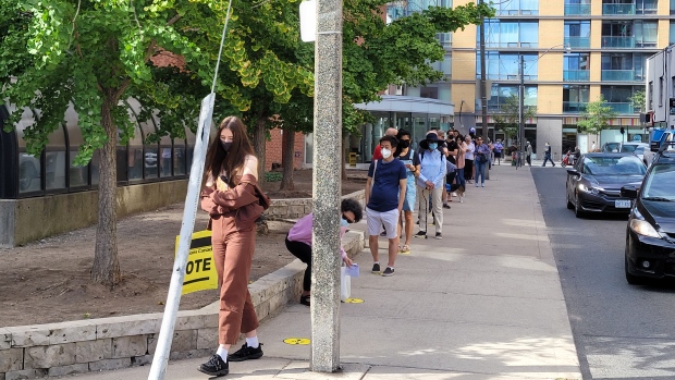 Long lineups form outside some polling stations across Toronto