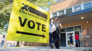 People arrive to cast their ballot on federal election day in Montreal, Monday, September 20, 2021. THE CANADIAN PRESS/Graham Hughes 